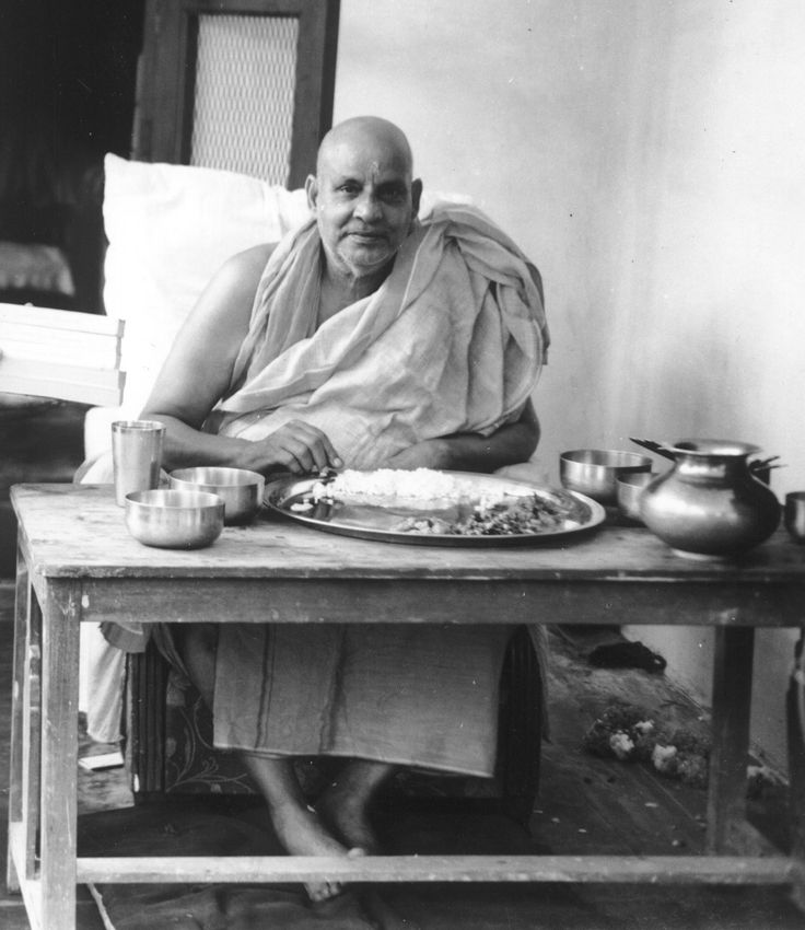 Swami Sivananda eating